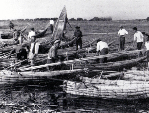 Fishermen on a raft with a Mullet rod (Cefalo) on the Sinis coast in the Gulf of Oristano